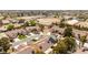 Residential area view showcases houses with red tile roofs and green lawns near a horse arena at 5612 Beach Mill Way, Las Vegas, NV 89130