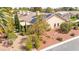 Roof top view of home with solar panels, mature trees and landscaping, offering privacy and shade at 5612 Beach Mill Way, Las Vegas, NV 89130