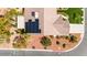 Aerial view of roof top with solar panels in a neighborhood with mature trees and landscaping at 5612 Beach Mill Way, Las Vegas, NV 89130
