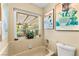 Bathroom featuring a tub with a view of the backyard at 5612 Beach Mill Way, Las Vegas, NV 89130