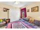 Bedroom boasting soft natural light and a comfortable bed with quilts and pillows at 5612 Beach Mill Way, Las Vegas, NV 89130