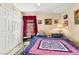 Bedroom featuring a cozy bed with a colorful quilt and a window view at 5612 Beach Mill Way, Las Vegas, NV 89130