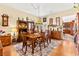 Charming dining room featuring wood floors, a vintage chandelier, and classic furnishings at 5612 Beach Mill Way, Las Vegas, NV 89130