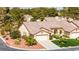 Attractive single-Gathering home with manicured landscaping, a three-car garage, and a well-maintained lawn at 5612 Beach Mill Way, Las Vegas, NV 89130