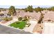 Inviting single-Gathering home with a three-car garage, lush lawn, and mature trees at 5612 Beach Mill Way, Las Vegas, NV 89130