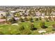 A charming neighborhood sits adjacent to a manicured golf course with mature trees and sand traps at 5612 Beach Mill Way, Las Vegas, NV 89130