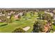 Scenic view of a golf course with lush green fairways, mature trees, and sand traps at 5612 Beach Mill Way, Las Vegas, NV 89130
