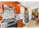 Contemporary kitchen equipped with stainless steel appliances, modern backsplash, and ample cabinet space at 5612 Beach Mill Way, Las Vegas, NV 89130