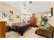 Bright main bedroom featuring a ceiling fan and ample natural light at 5612 Beach Mill Way, Las Vegas, NV 89130