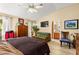 Spacious main bedroom with a seating area and backyard view at 5612 Beach Mill Way, Las Vegas, NV 89130