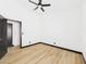 Bedroom with a modern ceiling fan and light wood-look floors at 566 Searchlight Dr, Las Vegas, NV 89110