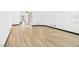 Bright bedroom featuring light wood flooring and a modern ceiling fan at 566 Searchlight Dr, Las Vegas, NV 89110
