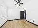 Bedroom featuring hardwood floors, ceiling fan, and black trim at 566 Searchlight Dr, Las Vegas, NV 89110