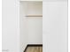 Open closet with wood floor, dark trim and sliding white doors at 566 Searchlight Dr, Las Vegas, NV 89110