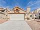 Charming single-story home featuring a two-car garage, stucco walls, and low-maintenance landscaping at 566 Searchlight Dr, Las Vegas, NV 89110