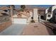 Charming single-story home featuring a two-car garage and desert landscaping at 566 Searchlight Dr, Las Vegas, NV 89110