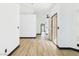 Bright interior featuring light wood flooring and crisp white walls, offering a modern aesthetic at 566 Searchlight Dr, Las Vegas, NV 89110