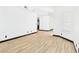Bright living room with light wood flooring and a large window at 566 Searchlight Dr, Las Vegas, NV 89110