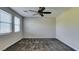 Spacious bedroom featuring plush carpet, neutral walls, and a ceiling fan at 5697 Garriga Dr, Las Vegas, NV 89135