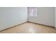 A bedroom with window, tile floors, neutral walls, and ample natural light at 5913 Smoke Ranch Rd # A, Las Vegas, NV 89108