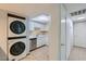 The kitchenette includes a laundry with white appliances and easy access to the hall at 5913 Smoke Ranch Rd # A, Las Vegas, NV 89108