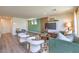 Cozy living room features wood look floors and a wood accent wall at 6172 Violet Fls # 42, North Las Vegas, NV 89081