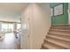 Entry with a carpeted staircase at 6172 Violet Fls # 42, North Las Vegas, NV 89081