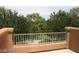Balcony with railing overlooking lush greenery and trees at 6528 Chebec St, North Las Vegas, NV 89084