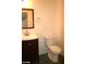 Bathroom featuring dark wood vanity with modern faucet and tiled floors at 6528 Chebec St, North Las Vegas, NV 89084