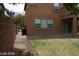 Exterior view of home with grass yard and covered patio at 6528 Chebec St, North Las Vegas, NV 89084