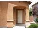 Close-up of a white front door with decorative pillars and neutral-colored exterior at 6528 Chebec St, North Las Vegas, NV 89084