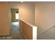 Upstairs hallway leads to room with window at 6528 Chebec St, North Las Vegas, NV 89084