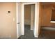 Hallway with neutral walls and carpet, showcasing access to other rooms at 6528 Chebec St, North Las Vegas, NV 89084