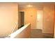 Hallway with neutral walls and carpet, featuring doors leading to other rooms at 6528 Chebec St, North Las Vegas, NV 89084
