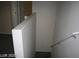A view of the hallway, banister, and stairs at 6528 Chebec St, North Las Vegas, NV 89084