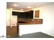 Lovely kitchen with tile floors, granite countertops, dark cabinetry, and stainless steel sink at 6528 Chebec St, North Las Vegas, NV 89084