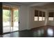 Spacious living room with tile flooring, a sliding glass door, and multiple windows at 6528 Chebec St, North Las Vegas, NV 89084