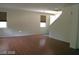 Bright living room with hardwood floors and multiple windows for ample natural light at 6528 Chebec St, North Las Vegas, NV 89084