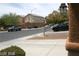 View of a residential street with cars parked and a home's exterior visible in the background at 6528 Chebec St, North Las Vegas, NV 89084