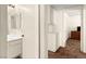 Bathroom with vanity, mirror and carpeted hallway view at 7008 Brown Derby Circle Dr, Las Vegas, NV 89128