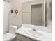 Simple bathroom with toilet, sink, mirror and walk-in shower at 7008 Brown Derby Circle Dr, Las Vegas, NV 89128