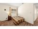 This bedroom features a patterned bedspread, window, and neutral paint at 7008 Brown Derby Circle Dr, Las Vegas, NV 89128