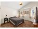 Cozy bedroom with a neutral color scheme, vaulted ceilings, and bright windows at 7008 Brown Derby Circle Dr, Las Vegas, NV 89128