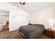 Bedroom with a neutral color scheme, vaulted ceilings, and access to the hallway at 7008 Brown Derby Circle Dr, Las Vegas, NV 89128