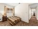 This bedroom features a window with blinds and a patterned bedspread at 7008 Brown Derby Circle Dr, Las Vegas, NV 89128