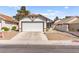 Charming single-story home featuring a two-car garage and low maintenance gravel landscaping at 7008 Brown Derby Circle Dr, Las Vegas, NV 89128