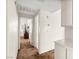 Hallway with brown carpet leading to bedrooms and bathrooms at 7008 Brown Derby Circle Dr, Las Vegas, NV 89128