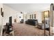 Spacious living room with neutral walls, plush carpeting, and large windows for natural light at 7008 Brown Derby Circle Dr, Las Vegas, NV 89128