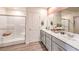 Modern bathroom with double vanity, spacious shower, and elegant finishes at 7441 Bosco Brook # 104, North Las Vegas, NV 89084