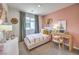 Cozy bedroom featuring a stylish desk area, soft lighting, and comfortable decor at 7441 Bosco Brook # 104, North Las Vegas, NV 89084